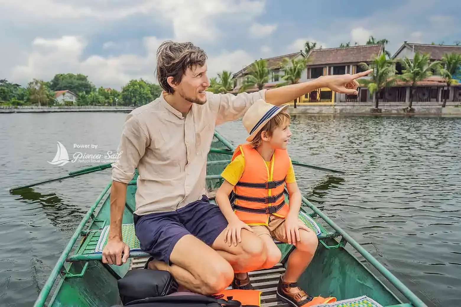 Dad And Son Tourists In Boat On The Lake Tam Coc Ninh Binh Viet Nam